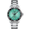 Tissot Seastar 1000 36mm T120.210.11.091.00 med turkis skive, sort dykkerbezel, datovisning ved klokken 6 og stållenke sett forfra.